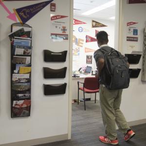 A high school senior walks into his college counselor's office.